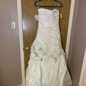 Maggie Sottero Couture wedding gown with tags.